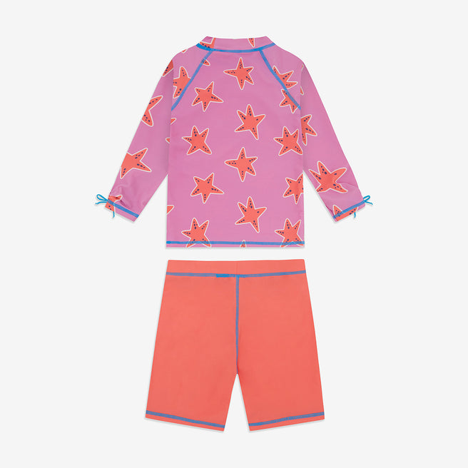 UV Protective Surf Set Pink Starfish, a two-piece swimwear set with a pink starfish-patterned top and coral shorts, perfect for sun protection.